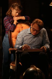 Sydney Lucas and Michael Cerveris in Fun Home, with music by Jeanine Tesori, book and Lyrics by Lisa Kron, based on the Alison Bechdel book, and directed by Sam Gold, running at The Public Theater at Astor Place. Photo credit: Joan Marcus.