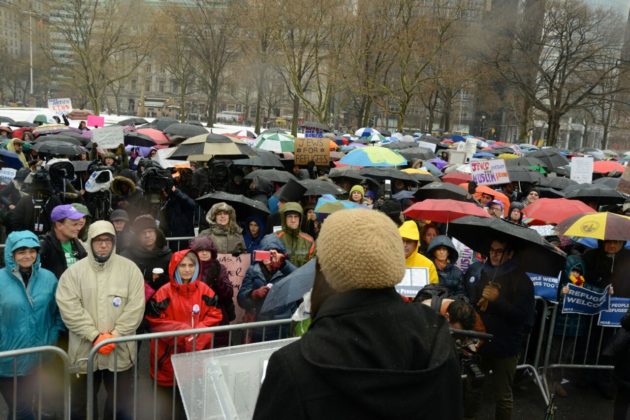 "Hundreds come together amid sleet and hail for the Jewish Rally for Refugees in Battery Park, New York," photo by Gili Getz