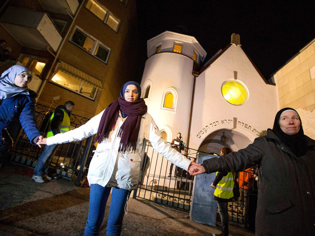 Muslims form a protective circle around Jews praying at a synagogue in Oslo, Norway, 2015.