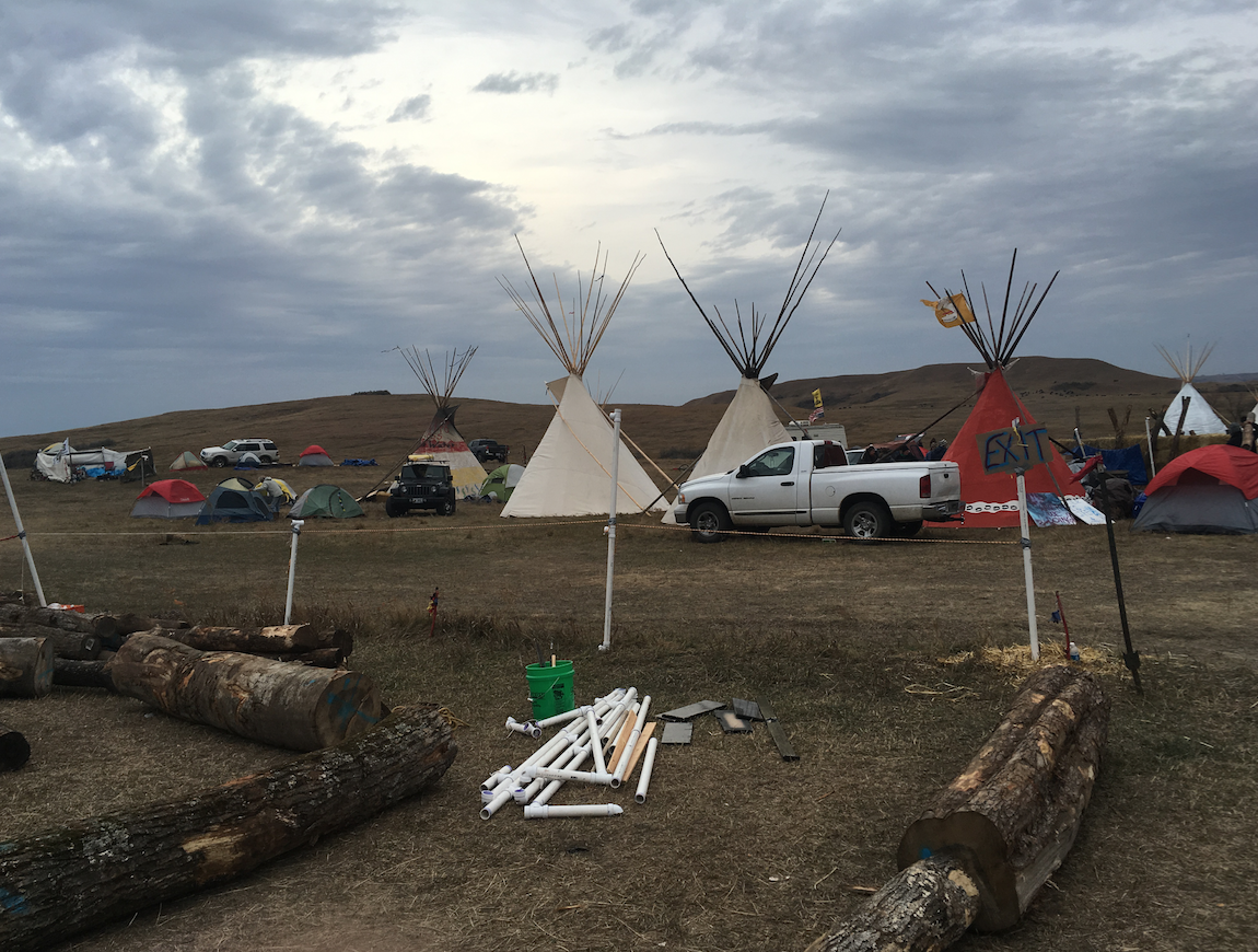 The winter camp claimed by eminent domain on the site of DAPL construction. The fence used the remains of our sukkah.