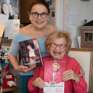 Tovah & Dr. Ruth grin holding copies of their respective books. 